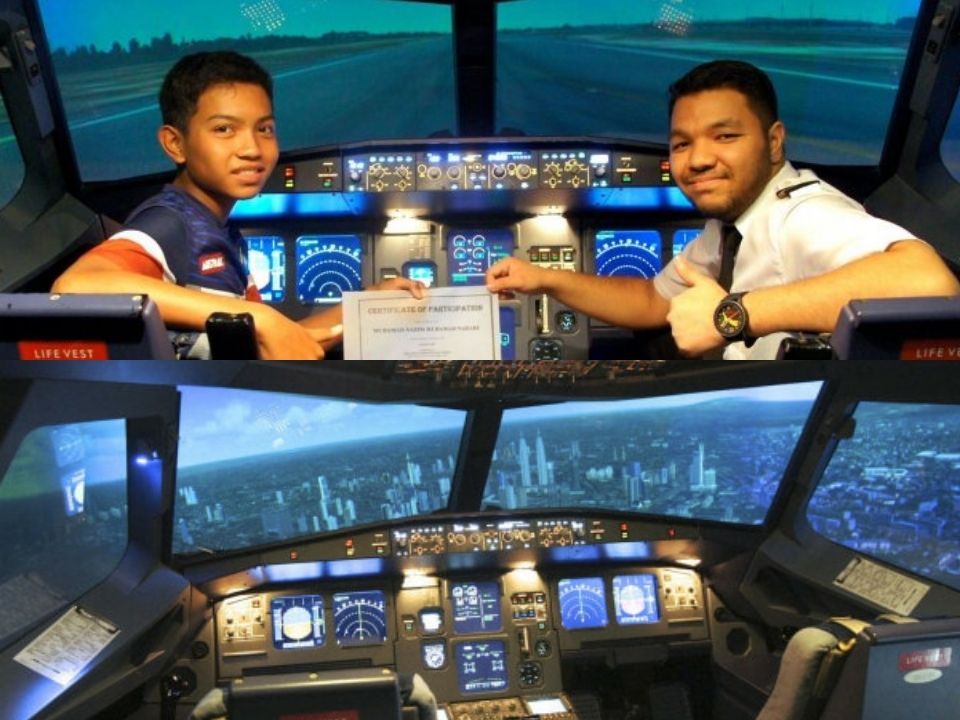 A student receiving a certificate from the pilot after training in the emulator